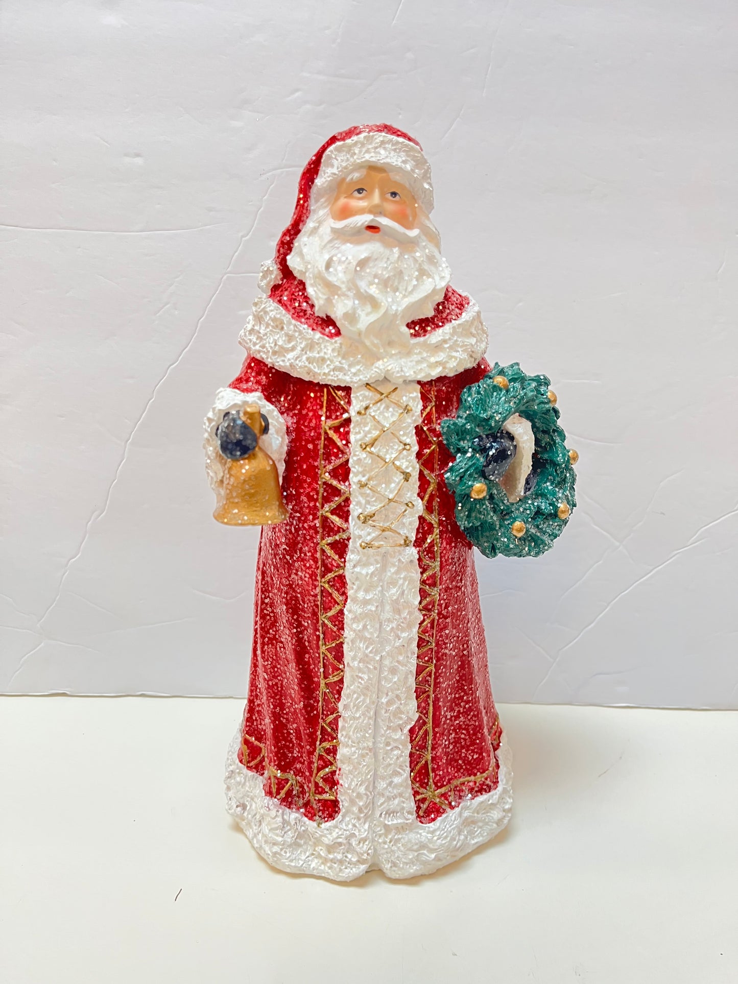11.75" Santa Holding Wreath and Bell